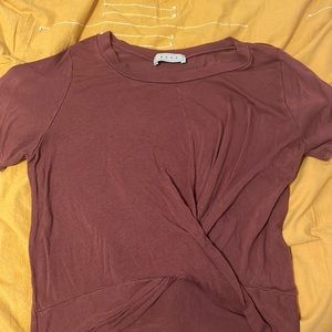 Dark red tee with a crossing design